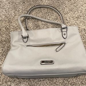 Cream colored Nicole Miller purse. Only used twice. New condition.